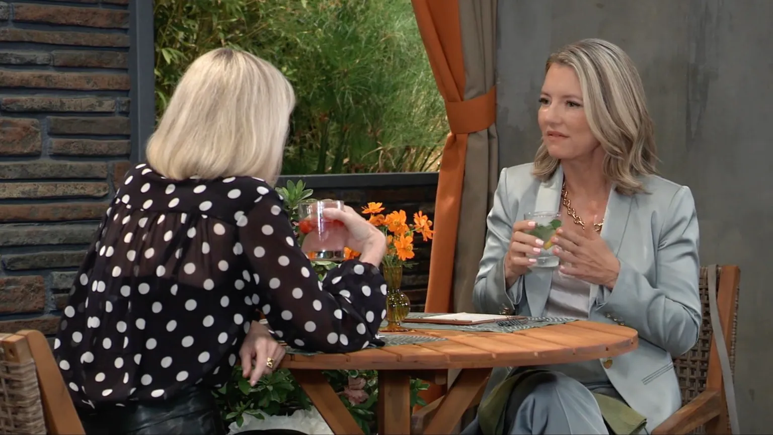 Ava tries to comfort Nina about Jack while Agent Baines secretly watches from nearby.